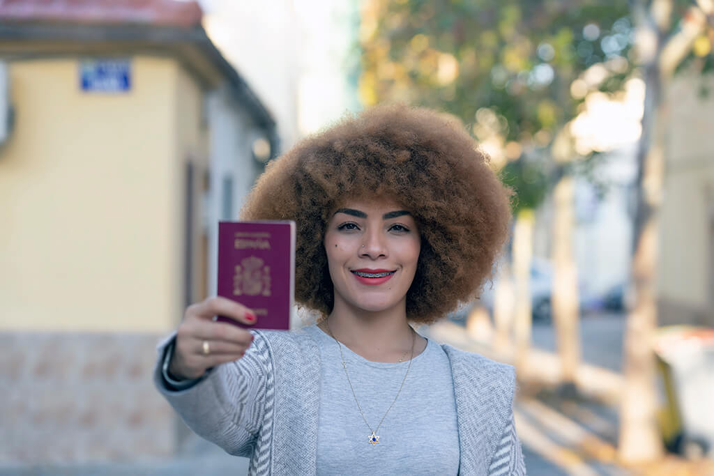 Woman Holding Spain Visa - Earthrelo